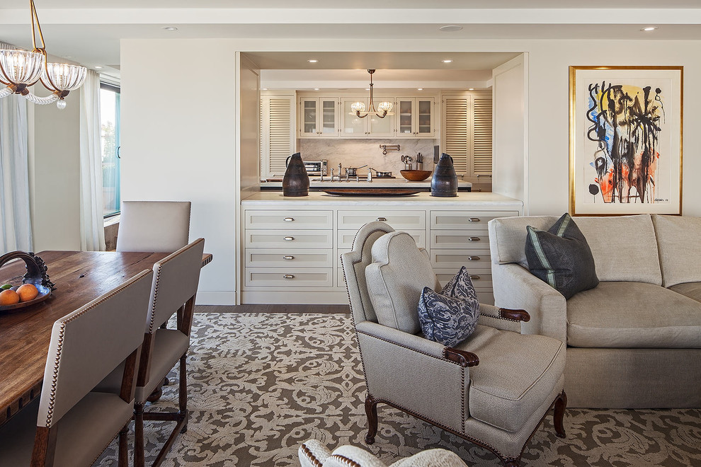This is an example of a traditional open concept family room in Toronto with beige walls.
