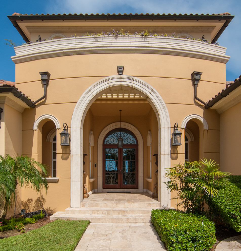 This is an example of a mediterranean entryway in Other with a double front door.