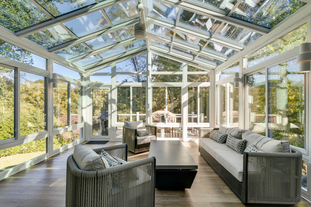 Inspiration for a transitional medium tone wood floor and brown floor sunroom remodel in DC Metro with a glass ceiling