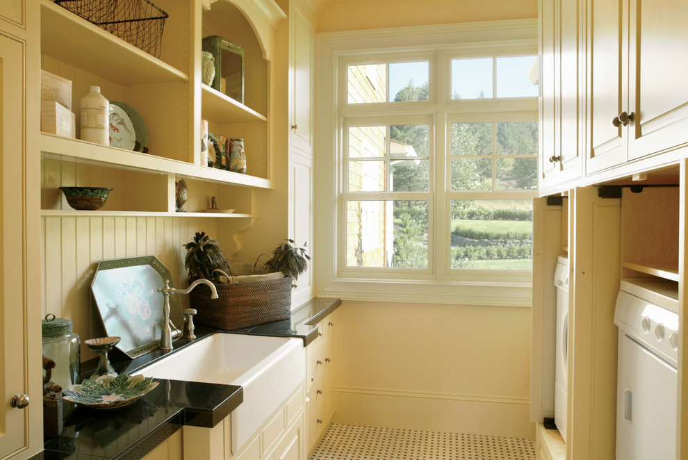Inspiration for a traditional laundry room in Portland with a farmhouse sink.