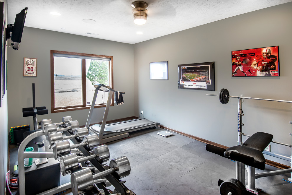 Design ideas for a mid-sized transitional multipurpose gym in Omaha with brown walls.