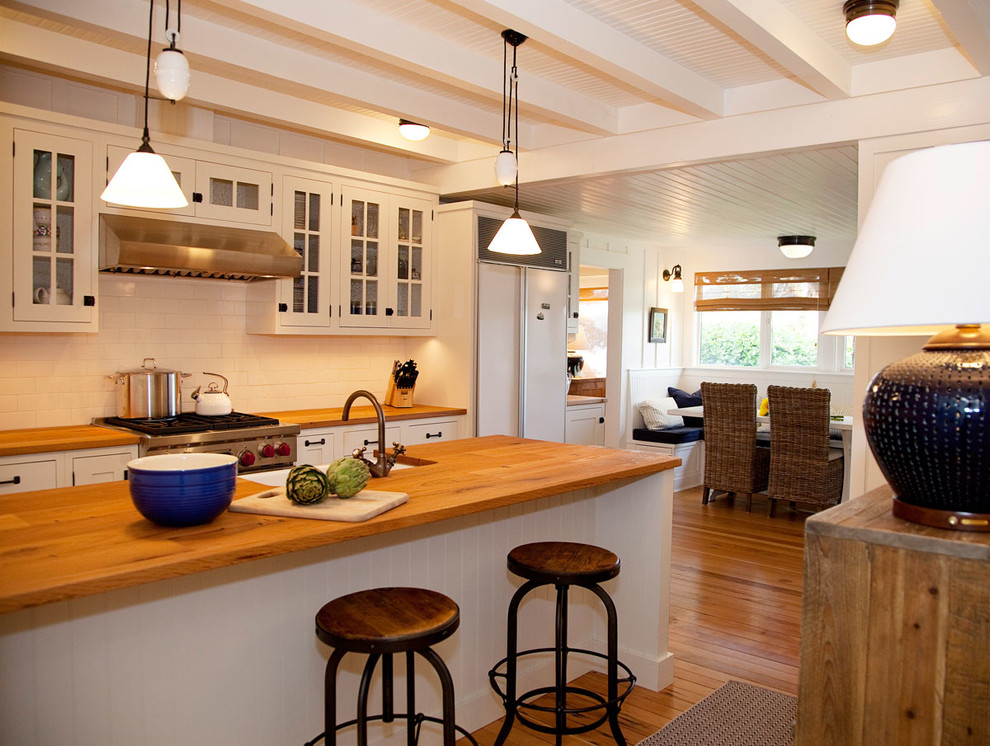 Design ideas for a traditional kitchen in Seattle with panelled appliances and wood benchtops.