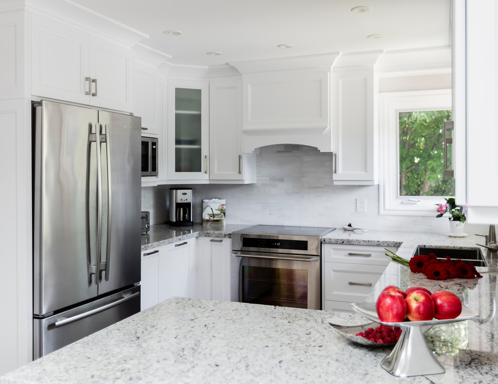 Example of a transitional kitchen design in Toronto