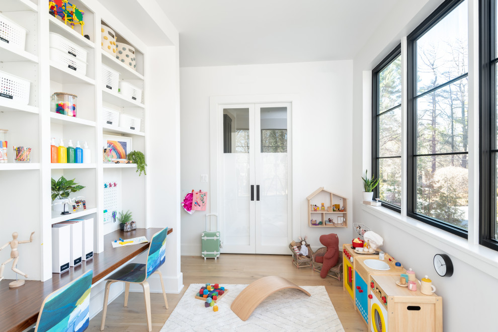 Inspiration for a contemporary gender neutral kids' bedroom in DC Metro with white walls, light hardwood flooring and beige floors.