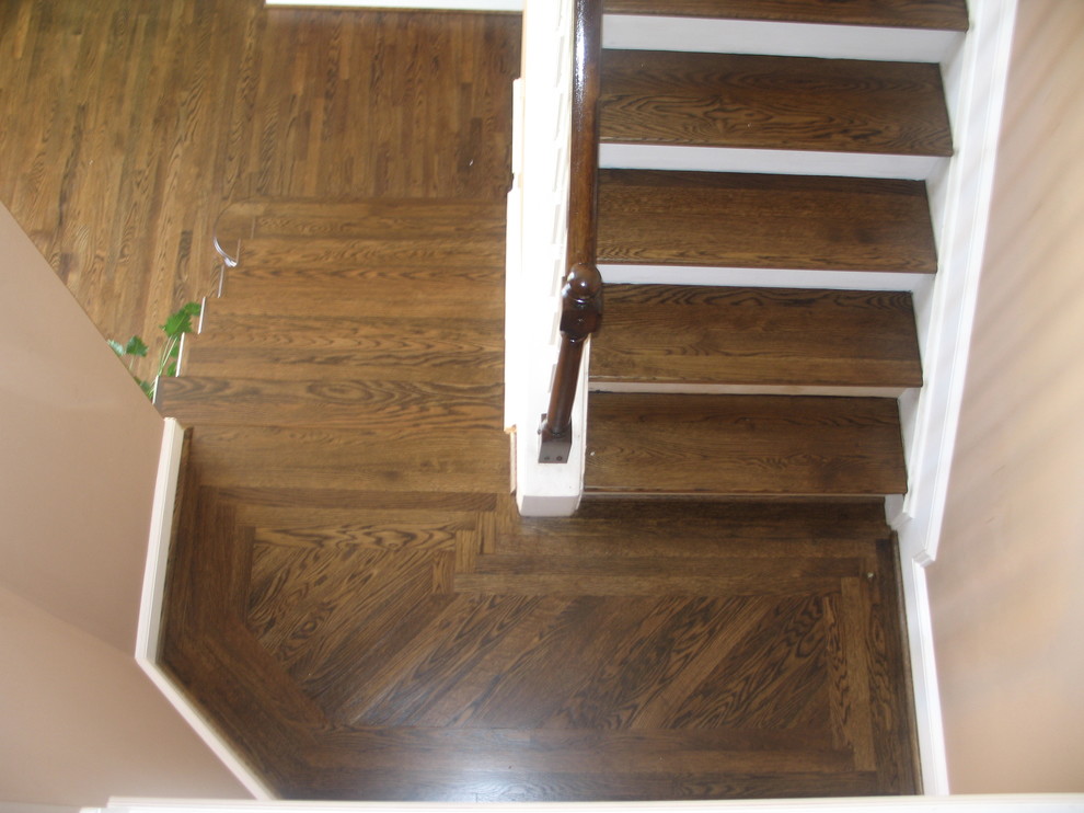Mid-sized traditional wood u-shaped staircase in Other with painted wood risers.