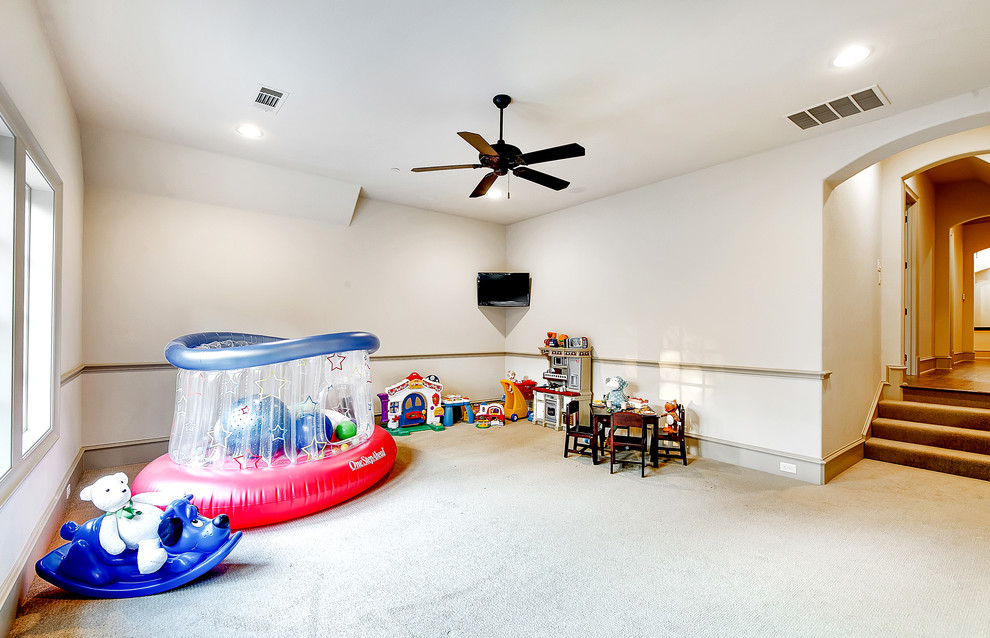 Large traditional kids' playroom in Dallas with carpet.