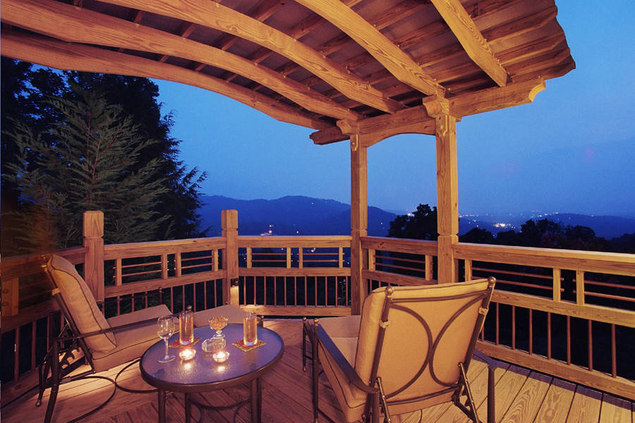 Design ideas for a mid-sized arts and crafts rooftop deck in Other with a pergola.