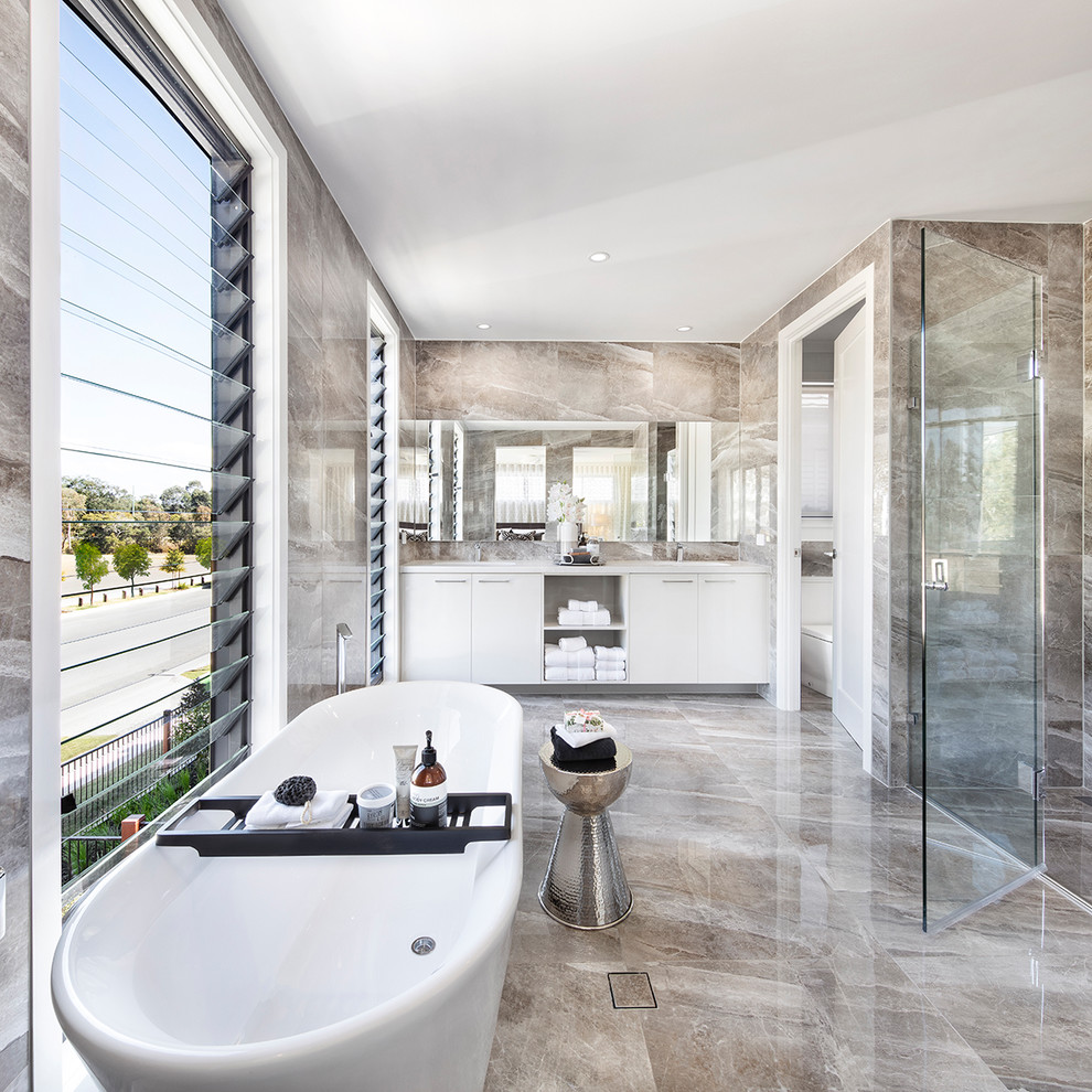 Inspiration for a contemporary master bathroom in Brisbane with flat-panel cabinets, white cabinets, a freestanding tub, a curbless shower, brown tile, an undermount sink, brown floor and a hinged shower door.