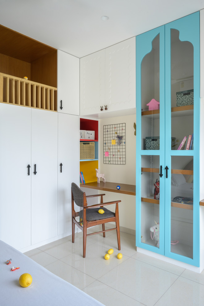 This is an example of an eclectic kid's room in Mumbai With White Walls.