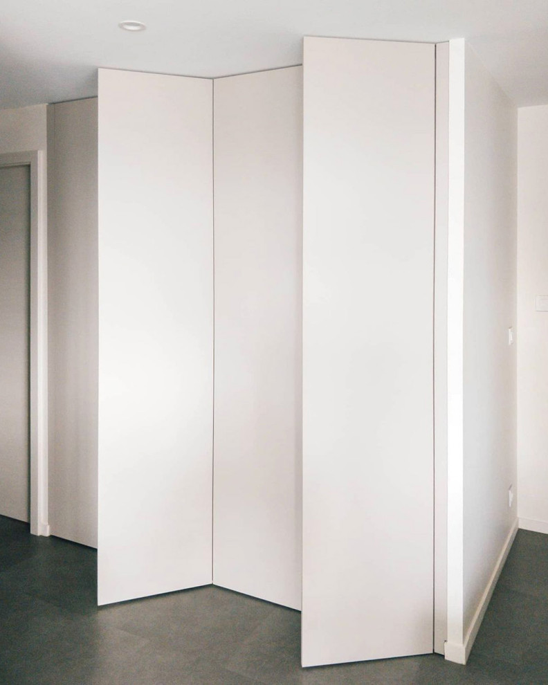 Photo of a mid-sized scandinavian gender-neutral storage and wardrobe in Other with beaded inset cabinets and beige cabinets.