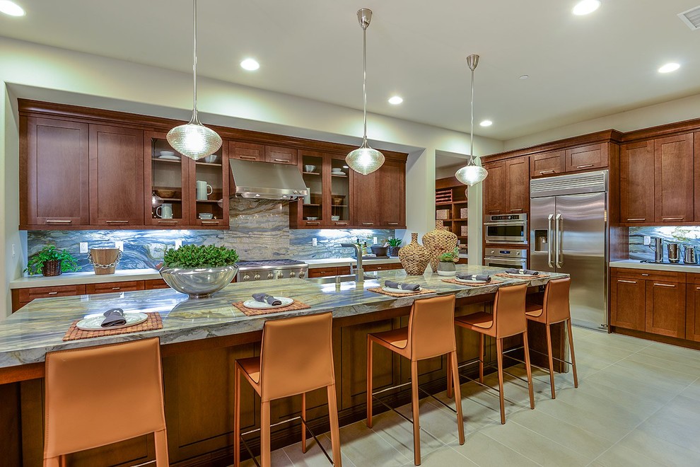Inspiration for a contemporary l-shaped open plan kitchen in Orange County with shaker cabinets and with island.