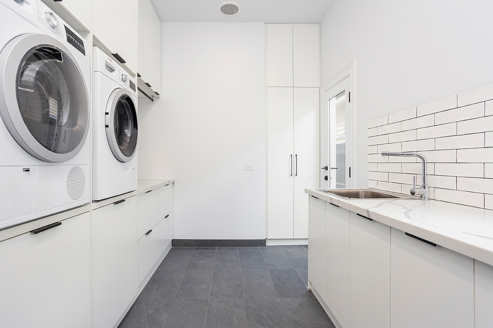 Transitional laundry room in Melbourne.
