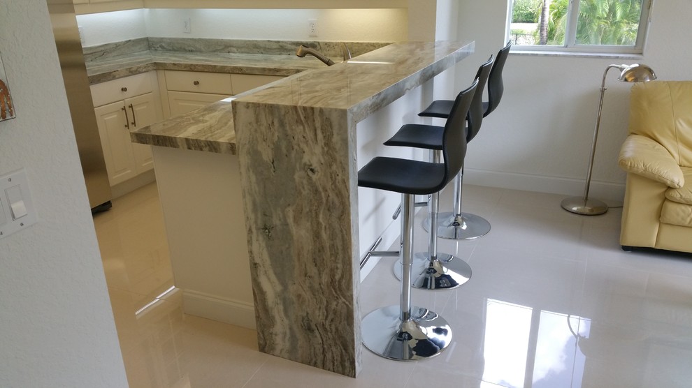 U-shaped kitchen in Miami with granite benchtops.