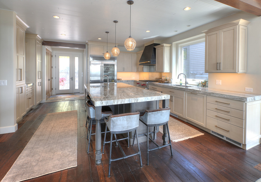 Eat-in kitchen - large transitional l-shaped dark wood floor eat-in kitchen idea with an undermount sink, shaker cabinets, white cabinets, stainless steel appliances, an island and marble countertops