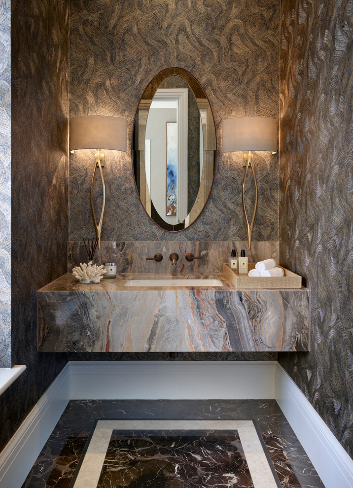 Mid-sized contemporary powder room in Berkshire with marble floors, an undermount sink and black floor.