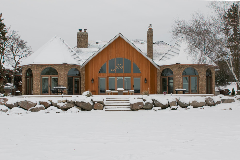 Design ideas for a large arts and crafts one-storey brown exterior in Minneapolis with wood siding and a gable roof.