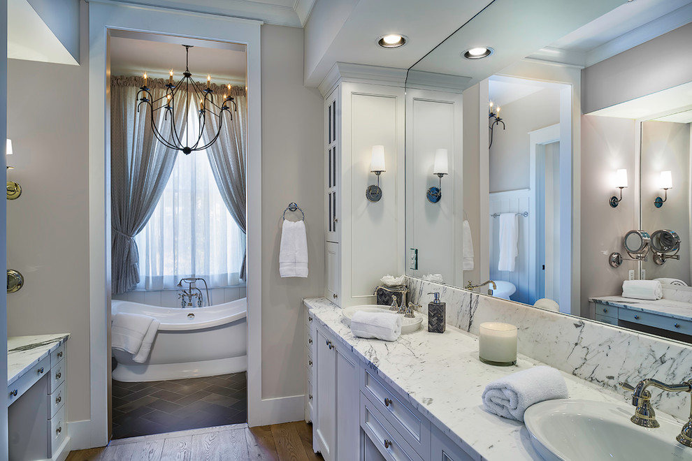 Small traditional master bathroom in Atlanta with beaded inset cabinets, white cabinets, gray tile, stone tile, beige walls, slate floors, an undermount sink, marble benchtops and a hot tub.