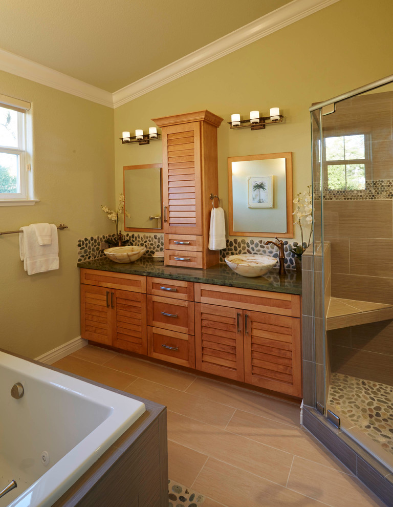 This is an example of a large arts and crafts master bathroom in San Francisco with a vessel sink, louvered cabinets, light wood cabinets, quartzite benchtops, a corner shower, beige tile, stone slab, beige walls, travertine floors and a drop-in tub.
