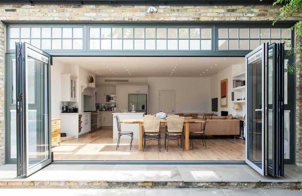 Photo of a transitional open plan dining in London.