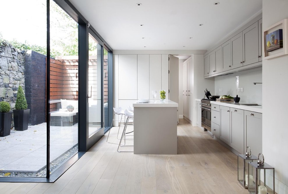 Design ideas for a contemporary kitchen in Dublin with grey cabinets.