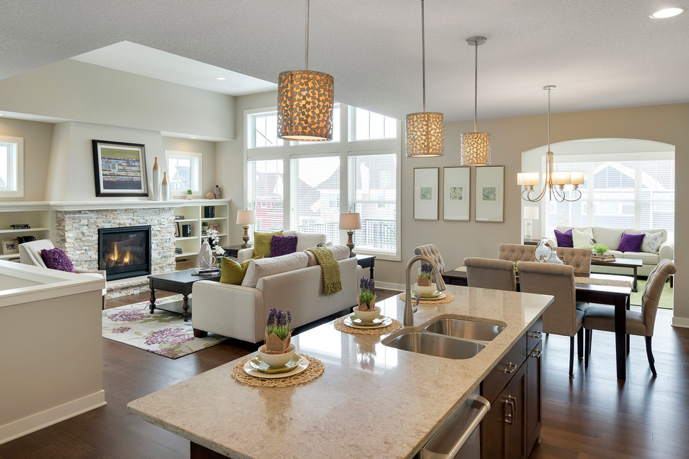 Inspiration for a transitional dark wood floor kitchen remodel in Minneapolis with a double-bowl sink, quartzite countertops, white backsplash, stone tile backsplash, stainless steel appliances and an island