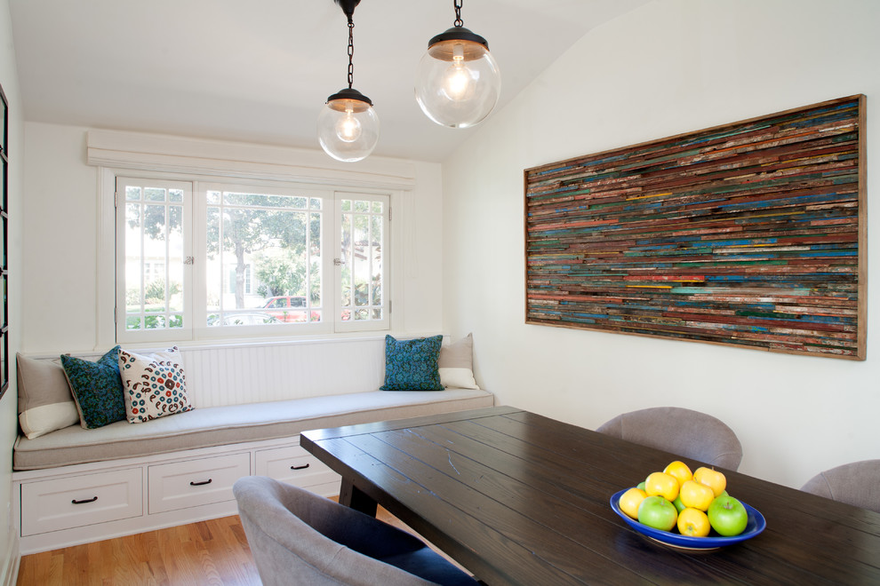 Design ideas for an arts and crafts dining room in Los Angeles with light hardwood floors.