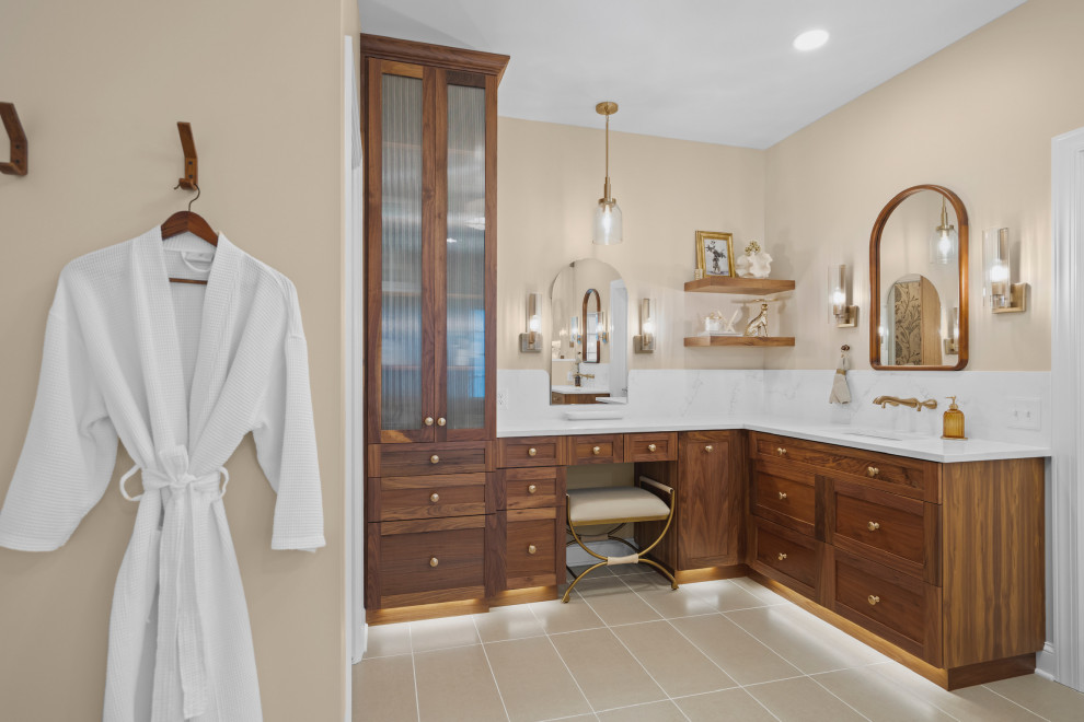 Transitional beige floor and single-sink bathroom photo with shaker cabinets, medium tone wood cabinets, beige walls, an undermount sink, white countertops and a built-in vanity