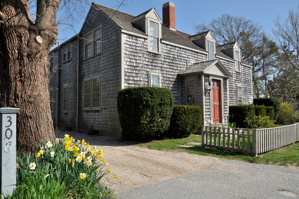 This is an example of a mid-sized traditional two-storey exterior in Boston with wood siding.