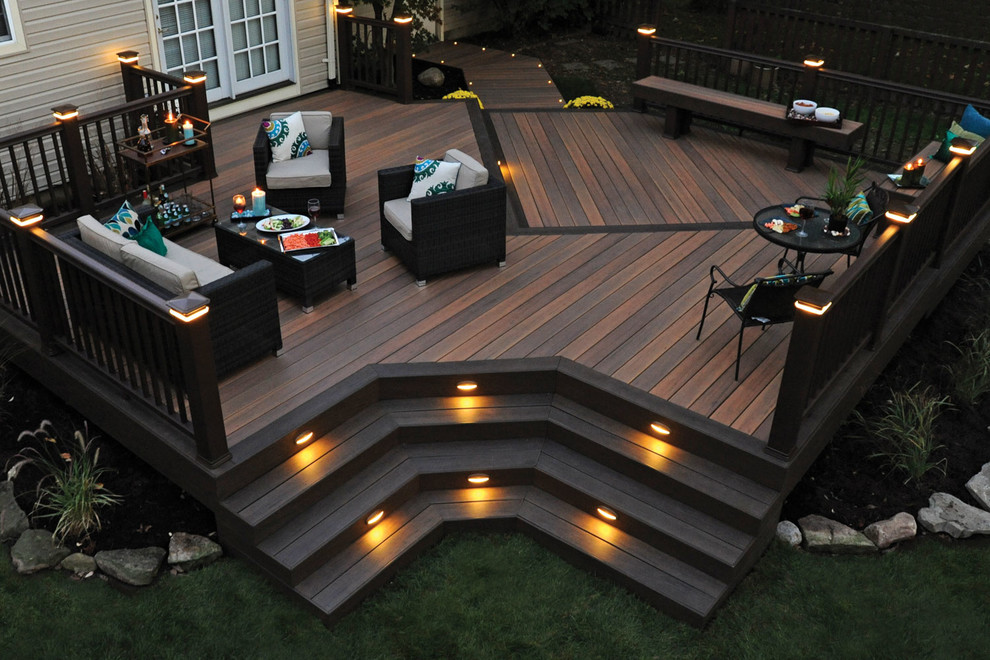 Large contemporary backyard deck in New York with no cover.