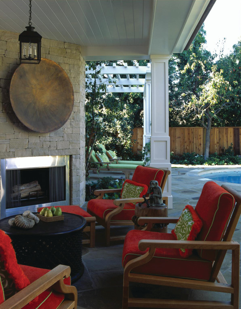 Inspiration for a traditional backyard patio in Orange County with a fire feature.