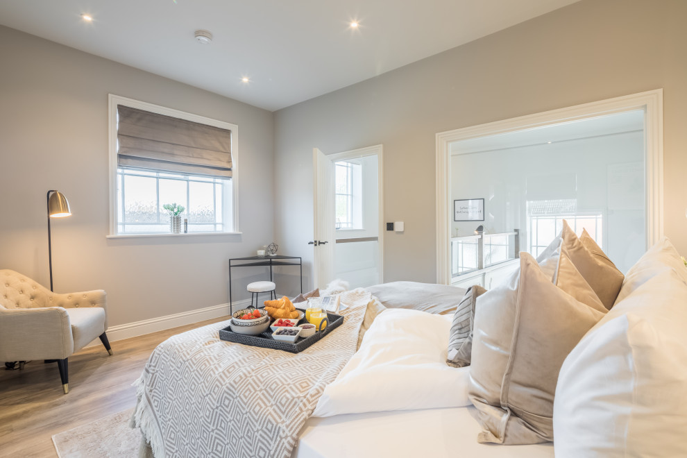 Design ideas for a transitional bedroom in Cambridgeshire.