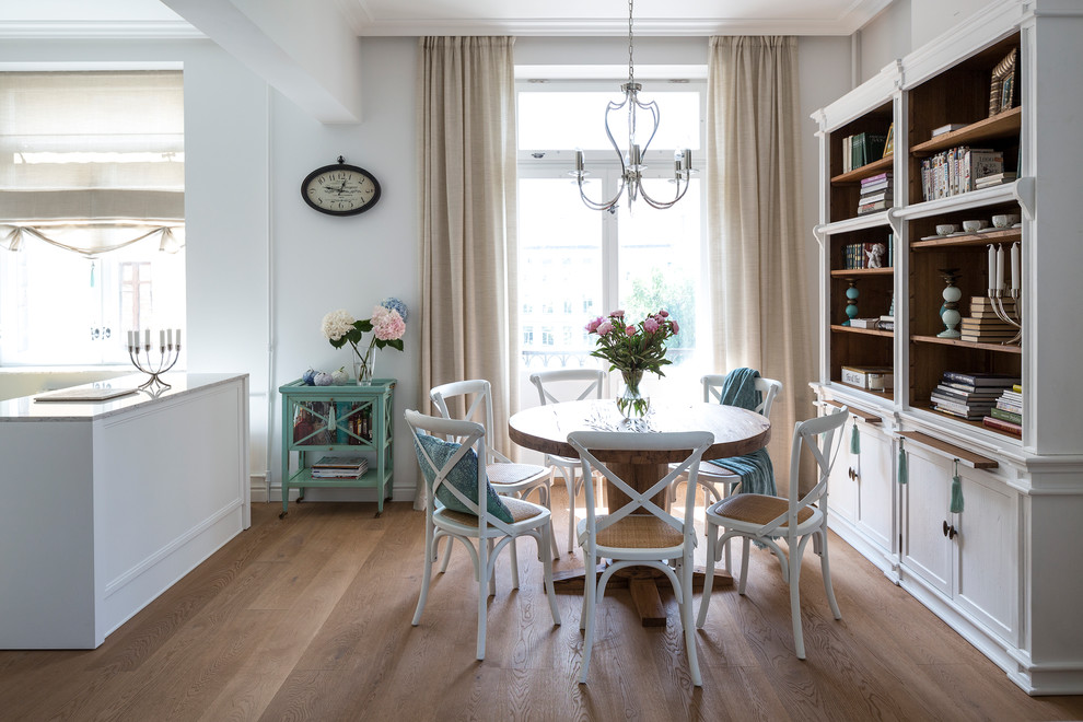 Inspiration for a transitional medium tone wood floor great room remodel in Moscow with white walls