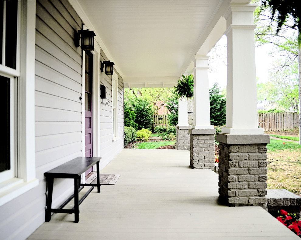 Design ideas for an arts and crafts front yard verandah in Charlotte with a roof extension.