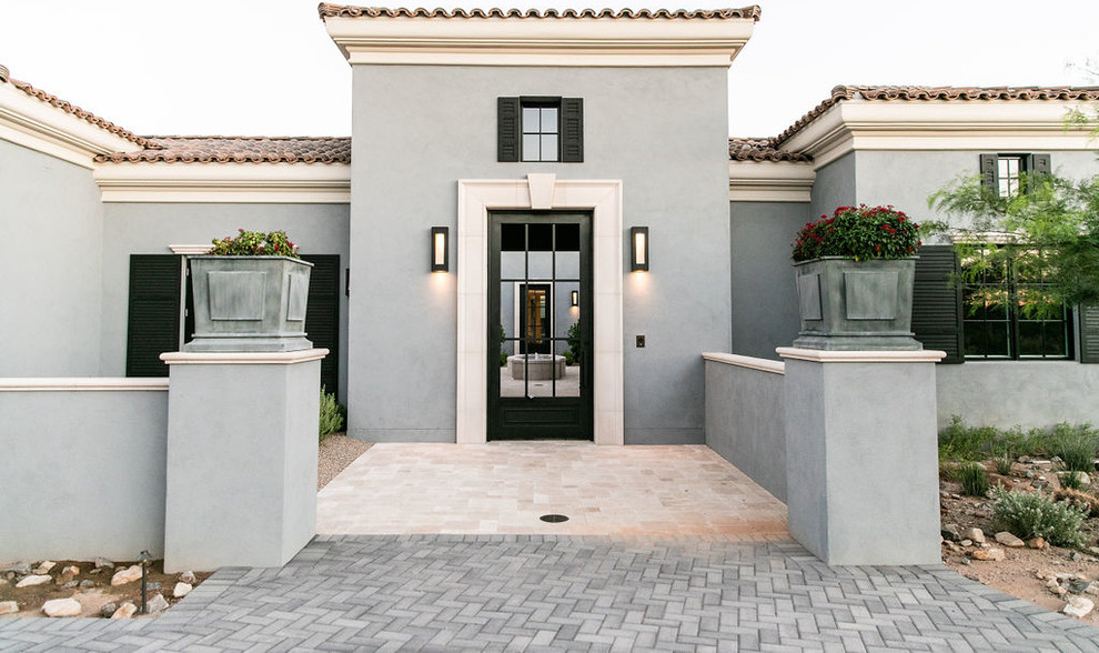 Inspiration for a transitional exterior home remodel in Phoenix