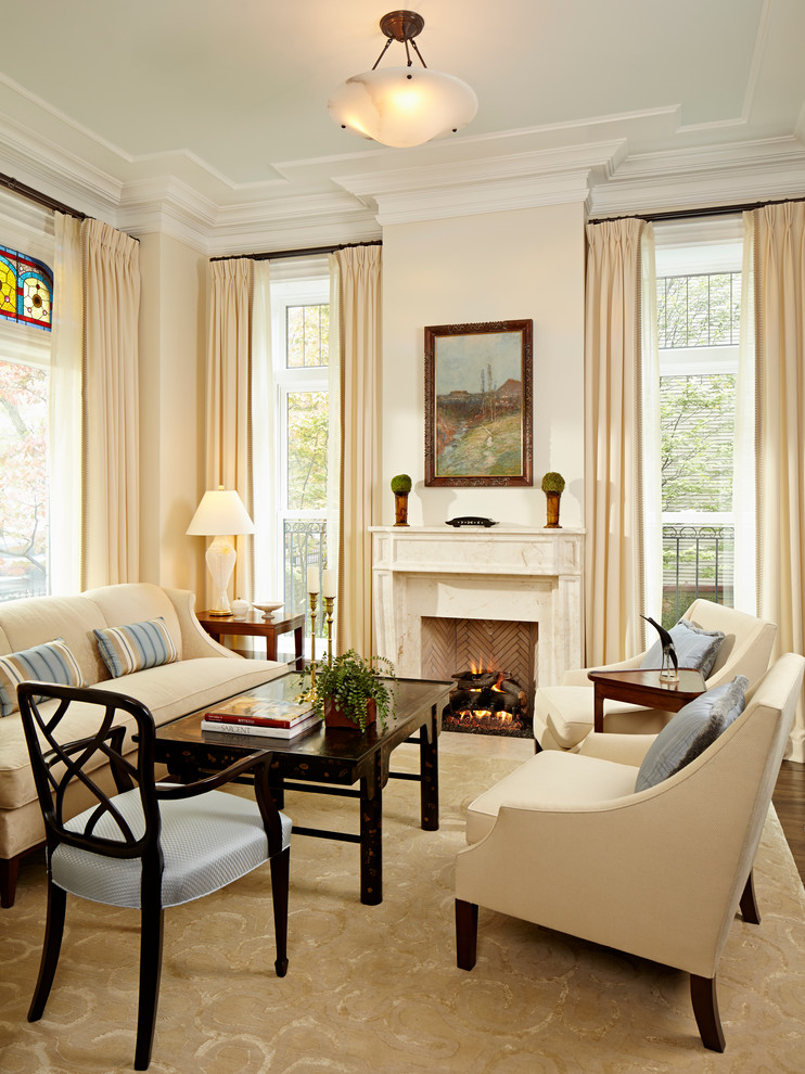 This is an example of a traditional living room in Chicago with beige walls.