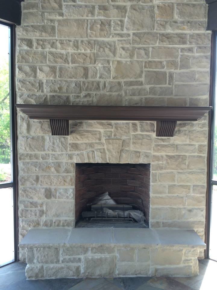 Inspiration for a backyard stone patio remodel with a fire pit