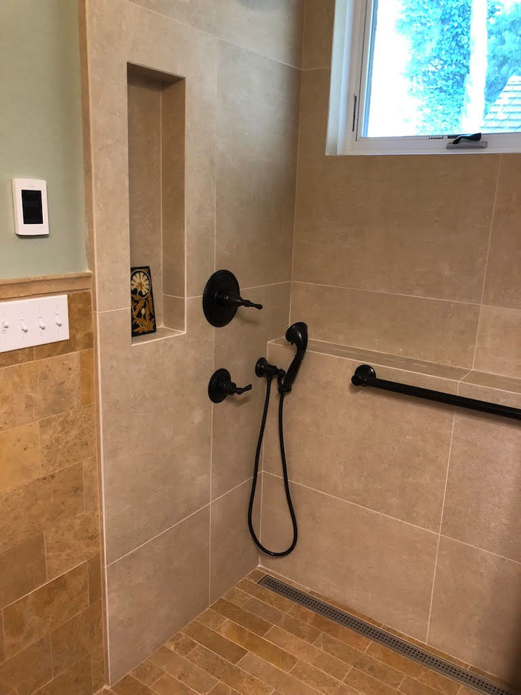 Photo of a small arts and crafts 3/4 bathroom in San Francisco with open cabinets, medium wood cabinets, a shower/bathtub combo, a one-piece toilet, beige tile, travertine, green walls, travertine floors, a vessel sink, beige floor and a shower curtain.