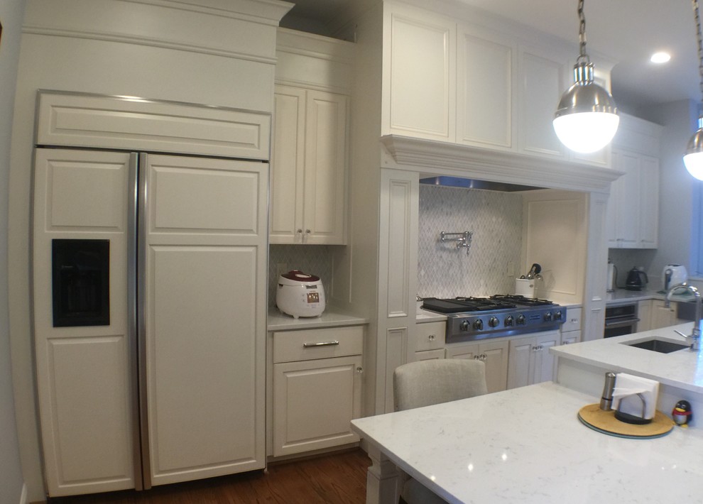 Inspiration for a large transitional u-shaped medium tone wood floor open concept kitchen remodel in DC Metro with an undermount sink, raised-panel cabinets, white cabinets, quartzite countertops, stainless steel appliances and an island