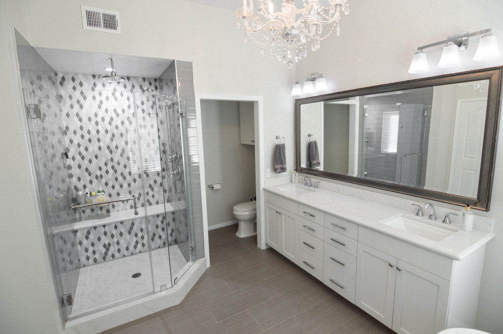 Example of a huge minimalist master porcelain tile, beige floor and double-sink bathroom design in Los Angeles with shaker cabinets, white cabinets, a two-piece toilet, an undermount sink, quartz countertops, a hinged shower door, white countertops and a built-in vanity