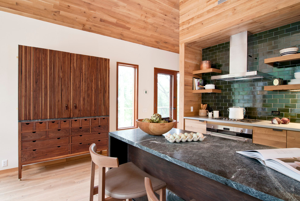 Inspiration for a contemporary light wood floor kitchen remodel in New York with medium tone wood cabinets, green backsplash, stainless steel appliances, an island, subway tile backsplash and open cabinets
