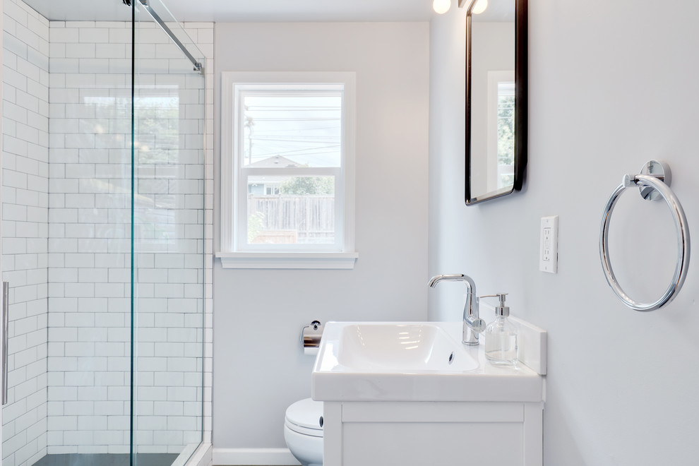 Example of a small minimalist 3/4 white tile and subway tile doorless shower design in Seattle with flat-panel cabinets, white cabinets and white countertops