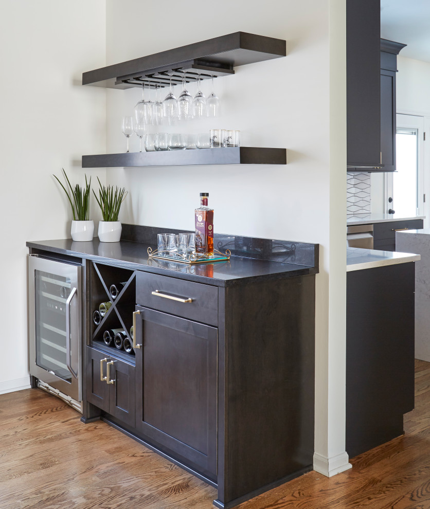 Large transitional medium tone wood floor and brown floor eat-in kitchen photo in Chicago with an undermount sink, blue cabinets, quartz countertops, white backsplash, ceramic backsplash, stainless steel appliances, an island and white countertops