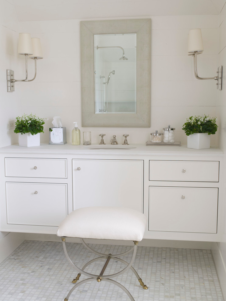 Inspiration for a large traditional bathroom in Charlotte with furniture-like cabinets, white cabinets, white tile, white walls, an undermount sink and marble benchtops.
