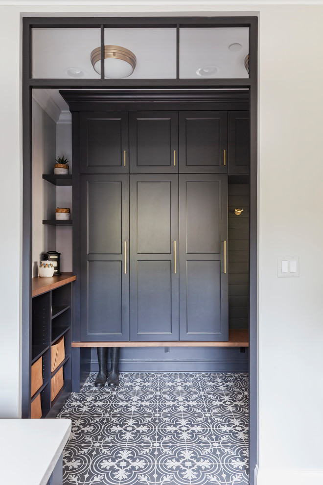 Example of a mid-sized beach style porcelain tile and multicolored floor entryway design in Chicago with gray walls and a gray front door