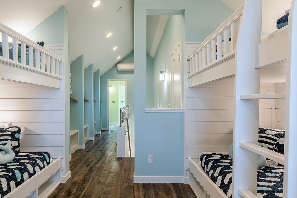 Inspiration for a mid-sized beach style gender-neutral kids' bedroom in Seattle with white walls, medium hardwood floors and brown floor.