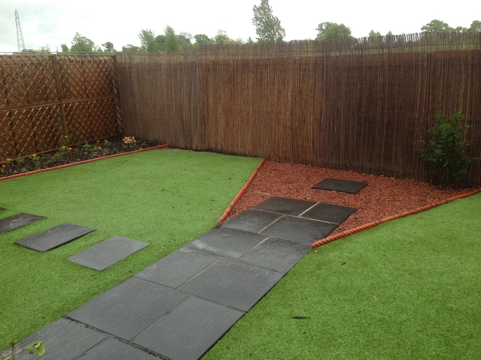 Design ideas for a small modern back partial sun garden in Oxfordshire with decking.