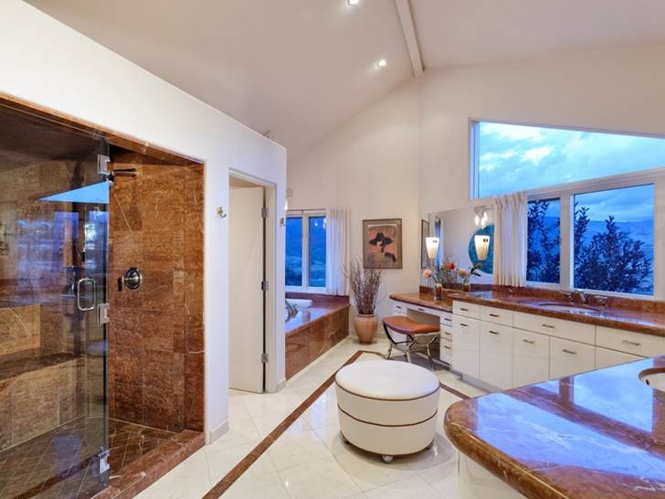 Inspiration for a mid-sized modern master bathroom in Denver with an undermount sink, flat-panel cabinets, white cabinets, marble benchtops, an undermount tub, an open shower, a one-piece toilet, multi-coloured tile, stone tile, white walls and marble floors.
