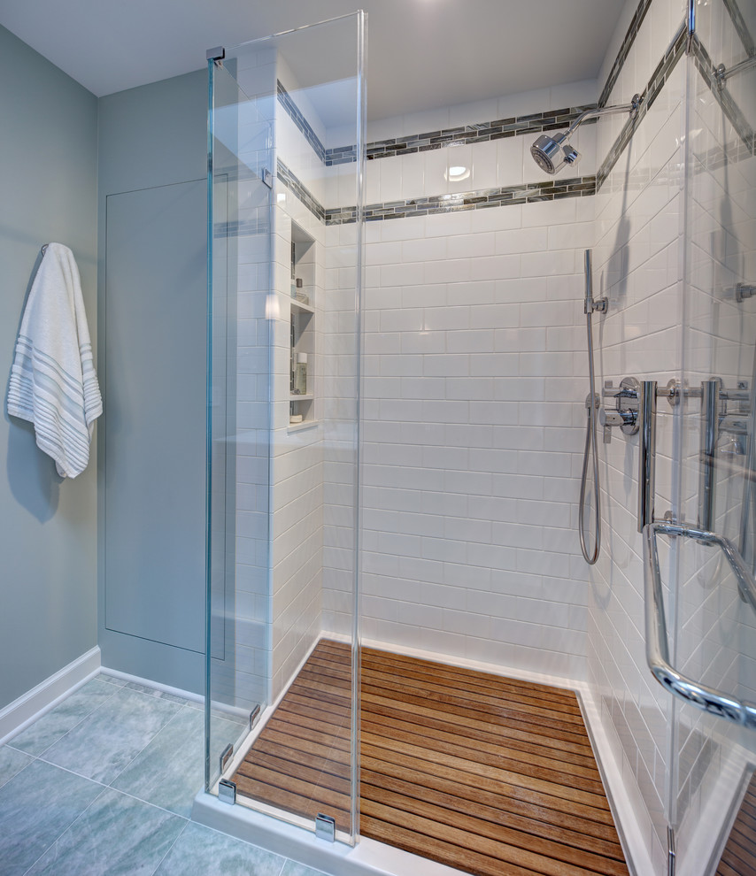 Design ideas for a small transitional master bathroom in New York with flat-panel cabinets, medium wood cabinets, white tile, ceramic tile, glass benchtops, a two-piece toilet, green walls, marble floors, an integrated sink, green floor and a hinged shower door.