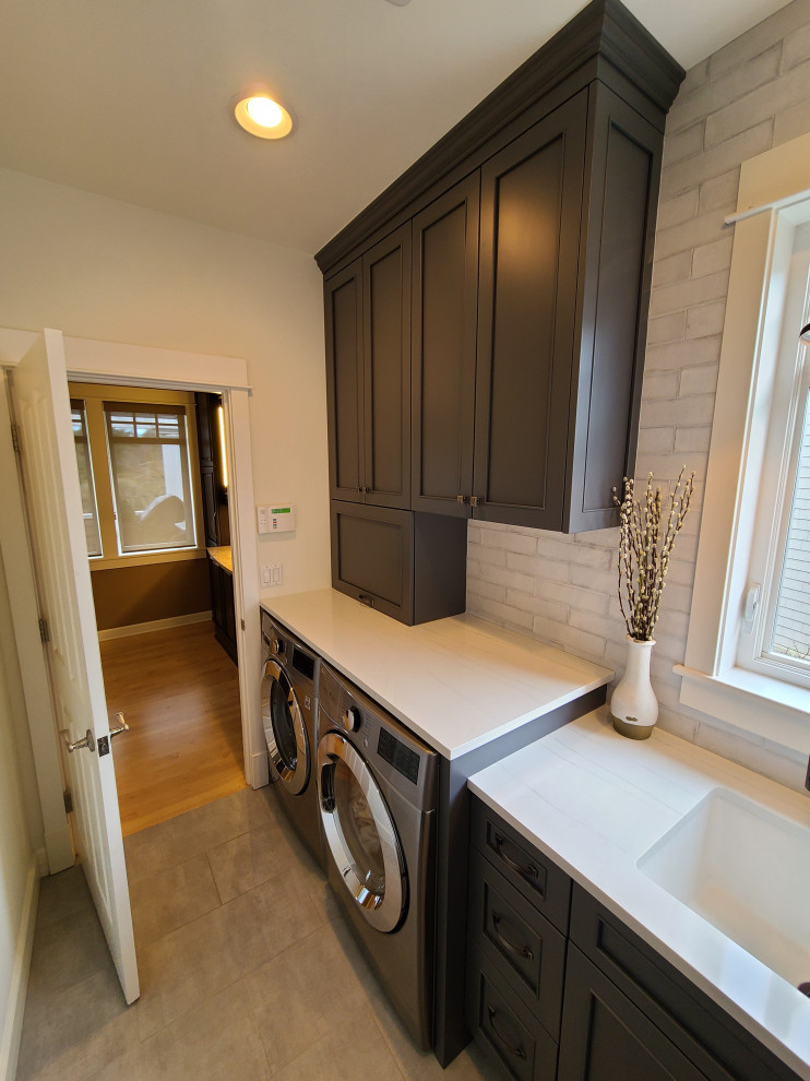 This is an example of a small classic single-wall utility room in Seattle.