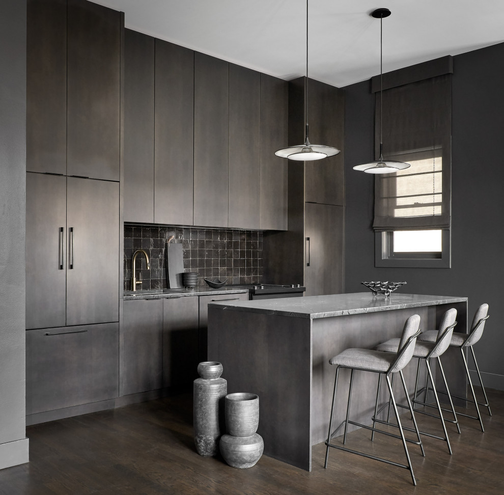 Photo of a mid-sized contemporary single-wall open plan kitchen in Chicago with an undermount sink, flat-panel cabinets, dark wood cabinets, quartzite benchtops, black splashback, terra-cotta splashback, panelled appliances, dark hardwood floors, with island and black benchtop.